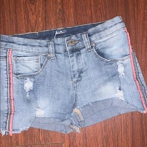 Jean shorts with red and black strips